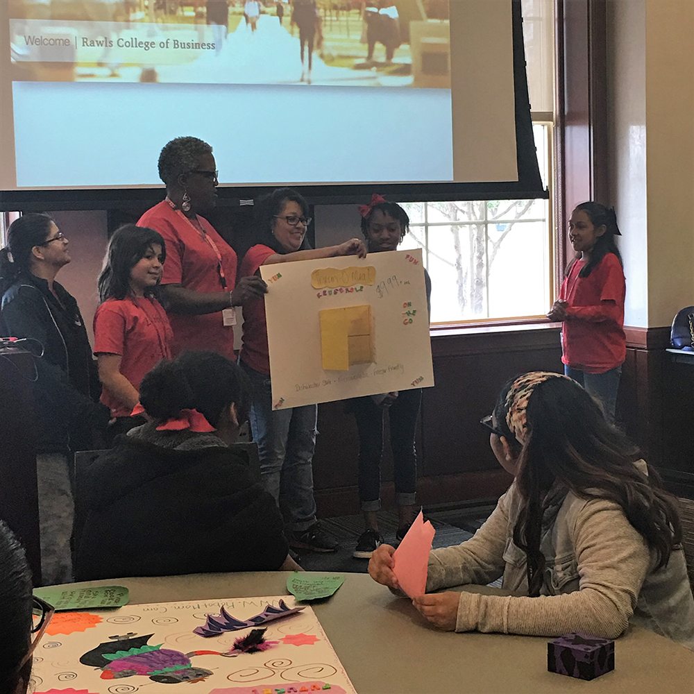 Middle school girls and their moms present products they created